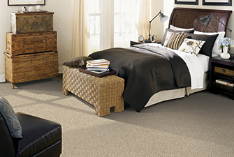 Bedroom scene with tan Softique carpet